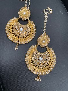 Gold plated round lightweight Chandbalis with Kundan. The oversized round earrings are a show stopper. Comes with pearls saharas attached. Easy push back closure. A perfect match to any desi outfit. Chandbalis Earrings, Bridal Necklace Set, Red Stone, Bridal Necklace, Round Earrings, White Ring, Matching Earrings, Perfect Match, Necklace Set