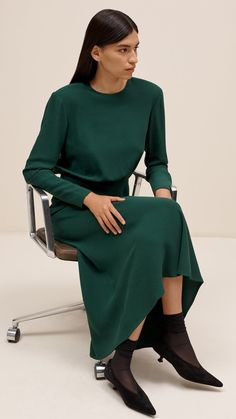 Round out your cold weather wardrobe with our rendering of the classic slim fit crepe dress. The Crosby Dress is made of soft Italian viscose wool and features a crewneck silhouette with a bias skirt. The blouson top boasts long sleeves and shoulder pads that add volume and visual interest to your look. Bias Skirt, Emerald Style, Blouson Top, Wool Crepe, Lapel Blazer, Good To See You, Brown Plaid, Crepe Dress, Wool Dress