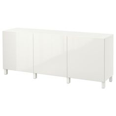 a white cabinet with three doors and two legs on the bottom, in front of a white background