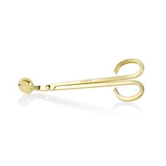 a pair of gold scissors sitting on top of each other