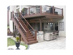 an outdoor patio with stairs and seating area