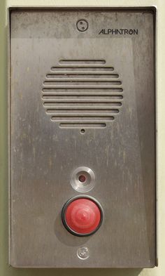 the red button is on the metal wall