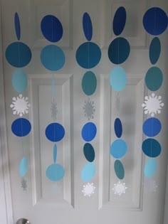 a door decorated with blue and white paper flowers