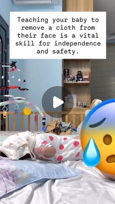 a baby laying on top of a bed in a room with a sign that says teaching your baby to remove a cloth from their face is a virtual skill for independence and safety