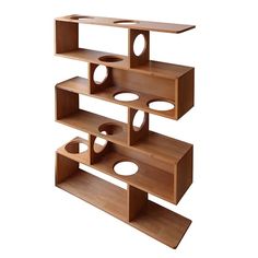 three wooden shelves stacked on top of each other with holes in the middle to hold items