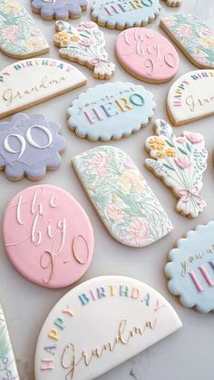 decorated cookies are arranged on a table