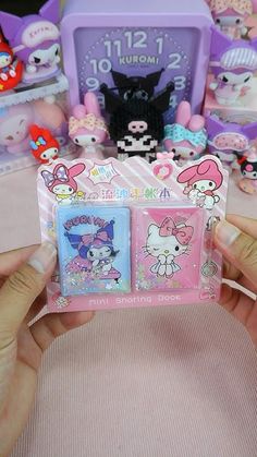 someone is showing off their new hello kitty watch and other items from the store that are for sale