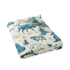 a blue and white blanket with an animal print on the front, folded in two rows