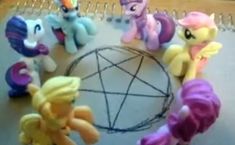 the little ponys are all lined up in a circle together on the table next to each other