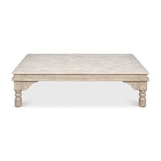 a white coffee table with wooden legs and a marble top on an isolated white background