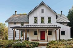 a white house with a red front door