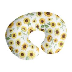 a sunflower print neck pillow with the letter o on it's front side