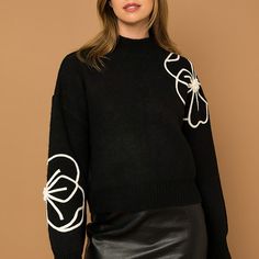 Winter Sweater With Floral Embroidery, Affordable Embroidered Winter Sweater, Luxury Embellished Spring Sweater, Luxury Black Sweater With Embroidered Logo, Luxury Fitted Tops With Ribbed Cuffs, Luxury Spring Sweater With Floral Embroidery, Luxury Floral Embroidered Sweater For Spring, Luxury Embroidered Long Sleeve Sweatshirt, Luxury Embroidered Logo Crew Sweater