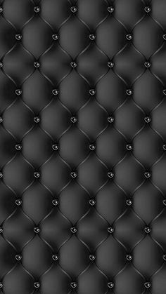 a black leather upholstered background with hearts