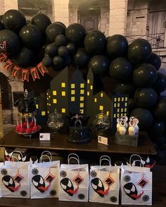 black and white party decorations on display in front of balloons