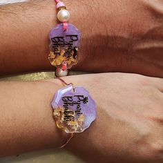 These handmade Resin Rakhi is perfect for your stylish brother and sister in law! Its shiny glossy resin and beautiful designs will make it a unique addition to the Raksha Bandhan celebrations. Make this Raksha Bandhan special with this stylish Resin Rakhi. Handmade Shiny Crystal Clear Resin  Sentiments written in gold foil Attractive ready to gift card packaging Multicolor Bracelets As Diwali Gifts, Handmade Bracelets As Diwali Gifts, Traditional Pink Bracelets For Gifts, Traditional Pink Bracelets As Gift, Spiritual Festive Gift Bracelets, Pink Bracelets As Festival Gifts, Spiritual Bracelets For Festive Gift, Spiritual Bracelets As Festive Gifts, Adjustable Bracelets For Diwali Gift