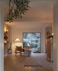 a living room filled with furniture and a large window