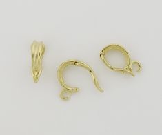 two pairs of gold plated metal hooks