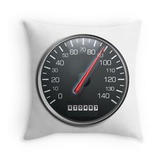 a white pillow with a black and red speedometer design on it's side