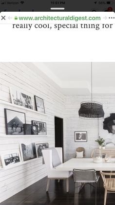 an image of a dining room setting with white walls and wood flooring in the background