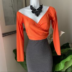 Prettylittlething Orange Wrap Crop Long Sleeve Top Super Cute And Sexy Top Long Sleeve Bright Orange Nwot Fabric 95% Polyester 5% Elastane Size 12 Measurements Laying Flat Chest-16” Length -10” Sleeve-19” Spring Bodycon Party Tops, V-neck Bodycon Top For Party, Bodycon V-neck Top For Party, Bodycon V-neck Party Top, Spring Chic Bodycon Crop Top, Chic Cropped Orange Top, Chic Bodycon Crop Top For Spring, V-neck Bodycon Top For Night Out, Chic Fitted Orange Crop Top