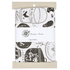 the fabric is printed with black and white images, including pumpkins and other things