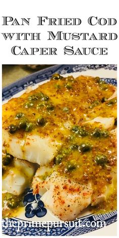 pan fried fish with mustard caper sauce on a blue and white plate, text overlay reads pan fried food with mustard caper sauce