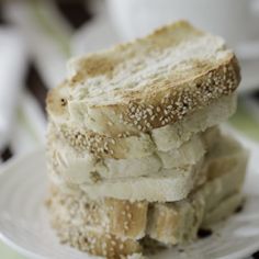 two pieces of bread stacked on top of each other with sesame seed sprinkles