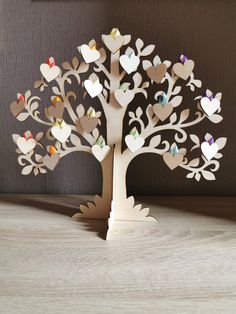 a wooden tree with hearts attached to it