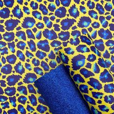 a blue and yellow animal print fabric