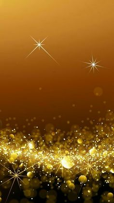 an abstract gold background with stars and sparkles