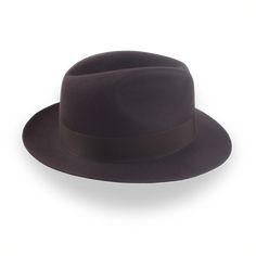 Description Materials Craftsmanship Hat Care Shipping Returns Product Description h2 { font-weight: lighter; } h3 { font-weight: lighter; padding-top:15px; } strong { font-weight: lighter; } Timeless Elegance with a Dark Brown Fedora Hat Elevate your style with The Acropol, a dark brown fedora hat that blends timeless elegance with modern sophistication. Crafted from luxurious beaver fur felt, this fedora features a classic center-dent crown and a smooth finish. Customizable in both crown height Mens Felt Hats, Spanish Hat, Brown Fedora, Homburg, Personalized Hats, Trilby Hat, Mens Fashion Classic, Classic Hats, Formal Casual