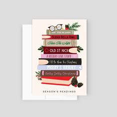 a christmas card with books stacked on top of each other