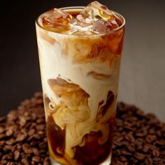 an iced drink with ice and coffee beans