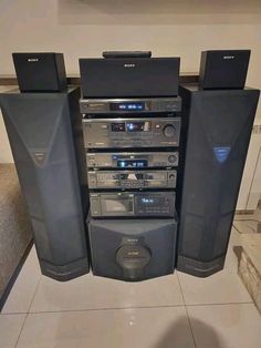 an array of stereos are stacked on top of each other