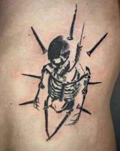 a man with a skeleton tattoo on his back holding a knife and fork in one hand