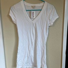 Plain White Tee Long, Slim Fit Zenana Outfitters Size Medium, But Slim Fit Makes It Feel More Like A Small To Me Purchased At Tj Maxx, New With Tags Basic V-neck Summer Shirt, Fitted V-neck Casual Shirt, White Stretch V-neck Shirt, Stretch Cotton V-neck Top, Casual Fitted V-neck Shirt, Grey Lace Shorts, Hot Pink Shorts, Plain White Tee, Distressed Tee