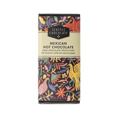 the mexican hot chocolate bar is made with dark chocolate and tropical leaves, on a white background