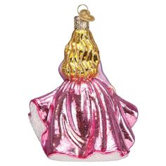 a pink and gold glass ornament with a woman's dress on it