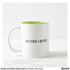 a white and green coffee mug with the words books - boys written in black on it