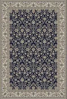 a blue and white rug with an ornate design on the bottom, in front of a black background