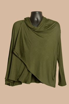 "Cardigan Wrap in olive green, pitch black, titanium blue, unisex, sweater, rayon Our decadent cardigan wrap adds that extra umph to your look, while keeping you cozy AF. The built in scarf, which doubles as a half-hood, brings together a design that ensures comfort and regal style. To close it up, button the vest to the neckline for a look that will have you feeling cool with warm vibes. Did we mention it has a pockets? A piece that adds flavor to casual days, perfect for layering when the cold begins to kick in. Colors: Pitch Black, Olive Green, Titanium Blue Sizes: Body Length (BL) x Body Width (BW) + Sleeve Length (SL) - (note: runs large)           Small: 22\"BL x 26\"BW + 20.5\"SL             Medium: 25\"BL x 27\"BW + 22\"SL           Large: 28\"BL x 29\"BW + 25\"SL Unisex Rayon Span Olive Long Sleeve Top For Layering, Olive Long Sleeve Sweater For Layering, Green Open Front Sweater For Layering, Green Open Front Top For Layering, Oversized Wrap Top For Fall, Wrap Sweaters, Regal Style, Hippie Tops, Stretch Headband