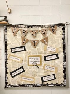 a bulletin board that has some words on it and pennants hanging from the wall