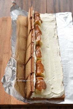 there is a long hot dog covered in frosting