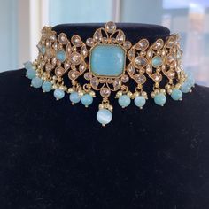 This gorgeous Light blue choker set is made from fine polki stones. Comes as a set with earrings and a head piece. ALL SALES ARE FINAL ON JEWELRY. KINDLY MESSAGE ME FOR ANY INQUIRIES. Polki Choker Set, Polki Choker, Blue Choker, Choker Set, Set Jewelry, Head Piece, Jewellery Sets, Jewelry Necklace, Indian Jewelry