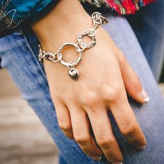 Rustic silver charms, hand sculpted links, and romantic charms all make up this rugged amulet heart charm bracelet. A single link reads "love your soul" on the back. Length 7 - 8" adjustable Sterling silver Lobster claw clasp Made by hand and heart Adjustable Metal Charm Bracelet With Heart Charm, Everyday Metal Chain Bracelet With Heart Charm, Adjustable Silver Heart Bracelet With Charms, Adjustable Metal Heart Bracelet With Charms, Silver Charm Bracelet With Heart Charm For Friendship, Metal Charm Bracelet With Dangling Charms, Spiritual Metal Chain Bracelet With Lobster Clasp, Adjustable Metal Chain Bracelet With Dangling Charms, Silver Chain Bracelet With Heart Charm For Friendship