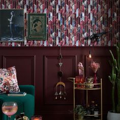 a living room filled with furniture and wallpaper