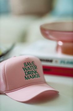 HAZEL & OLIVE Save Water Drink Margs Embroidered Trucker Hat - Pink Trendy Pink Trucker Hat With Curved Visor, White Dress Formal, Save Water Drink, Feather Tops, Water Drink, Summer Sundress, Beach Bridal, Top Graphic Tees, Save Water