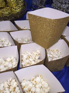 several boxes filled with popcorn sitting on top of a table