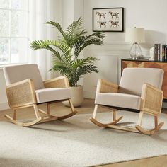 a living room with two rocking chairs and a potted plant